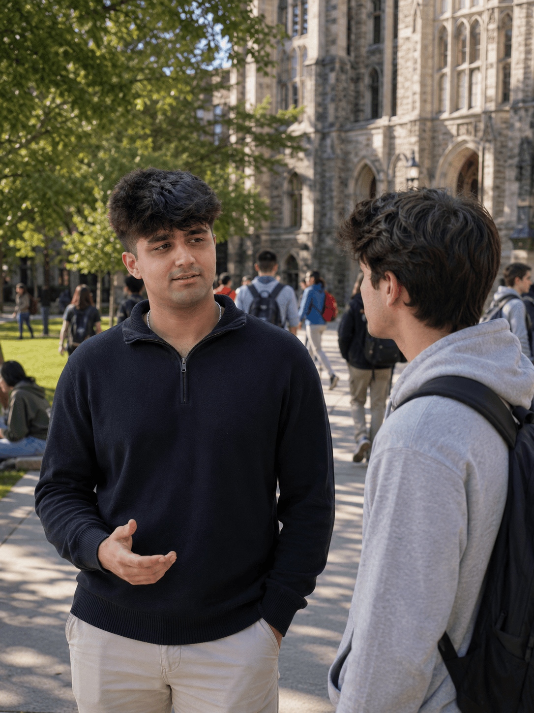 Kuvam, founder of Student Support USA, speaking with an Indian student on a US university campus